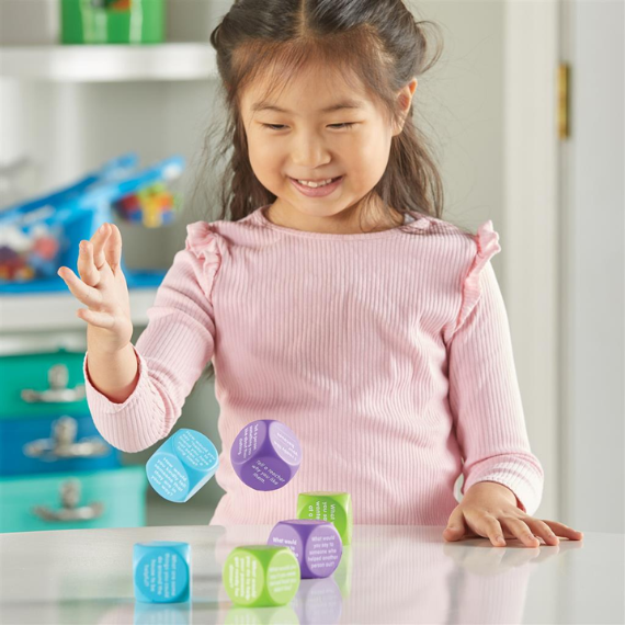 Girl plays with the Be Kind Cubes